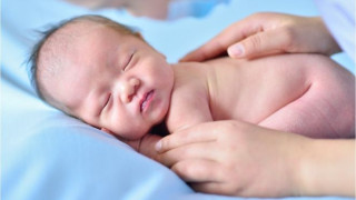 Gently stroking babies 'provides pain relief'