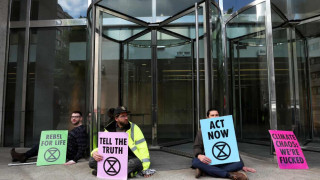 Extinction Rebellion activists glue themselves to London Stock Exchange